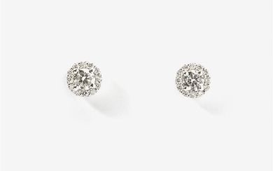A pair of white gold and diamond cluster...