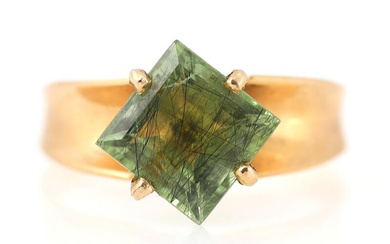A peridot ring set with a square-cut peridot, mounted in 18k gold....