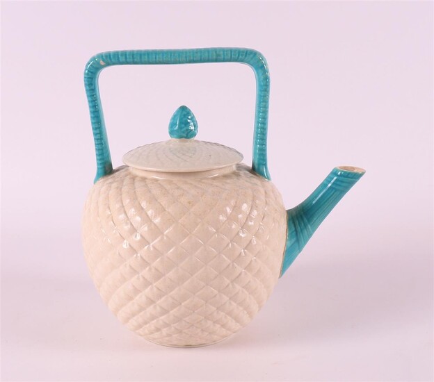 (-), A porcelain teapot with diamond relief and...