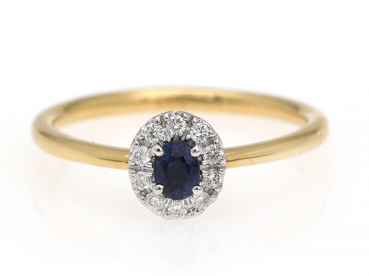 NOT SOLD. A sapphire and diamond ring set with a sapphire encircled by diamonds, mounted...