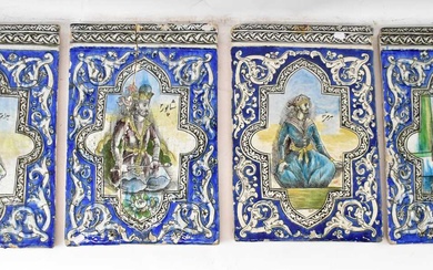 A set of four 18th/19th century large Persian tiles with...