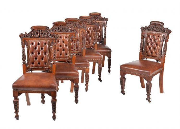 A set of six carved walnut dining chairs