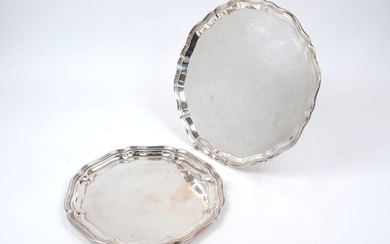 A shaped silver tray, Birmingham, 1945, Charles S Green & Co., with pie crust border, 36cm dia., together with a smaller silver plated example, 30cm dia., weighable weight approx. 30.9oz (2)