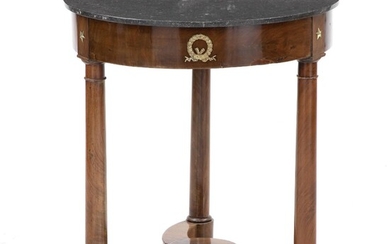 SOLD. A small French round mahogany table with Belgian granite top and gilt bronze mountings. Early 19th century. H. 73 cm. Diam. 65 cm. – Bruun Rasmussen Auctioneers of Fine Art