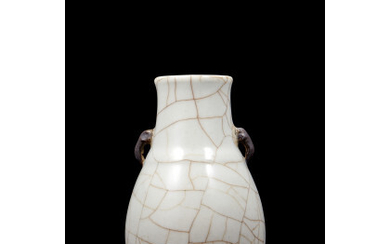 A small craquele glaze vase with elephant handles China, early 20th century (h. 16.2 cm.)