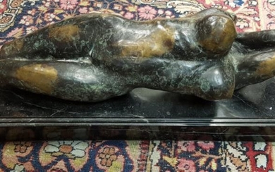 A verdigris patinated bronze study of a recumbent nude...