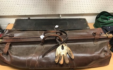 A vintage leather and brass embellished cricket bag of...