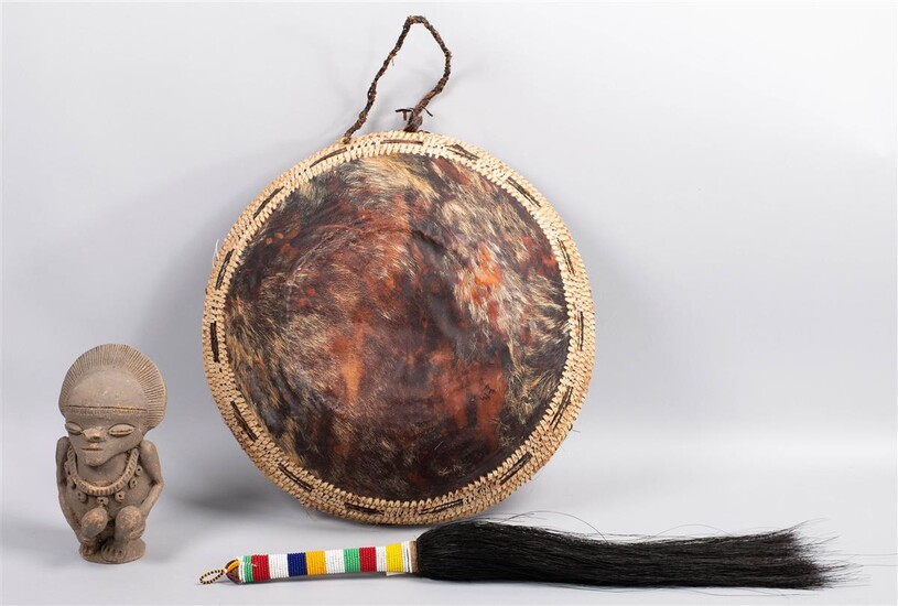 AFRICAN POTTERY FIGURE, A GOATSKIN BOWL AND A BEADED FLY WHISK
