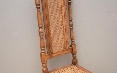 AN ANTIQUE CARVED OAK AND RATTAN DINING CHAIR (A/F) (131H x 46W x 46D CM) (LEONARD JOEL DELIVERY SIZE: MEDIUM)