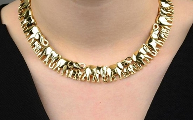 An 18ct gold emerald accent elephant collar, by