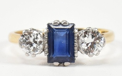 An 18ct gold, sapphire and diamond three stone ring. The rin...