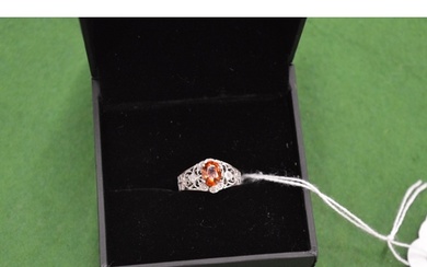 An 18ct white gold, diamond and orange sapphire ring, size N...