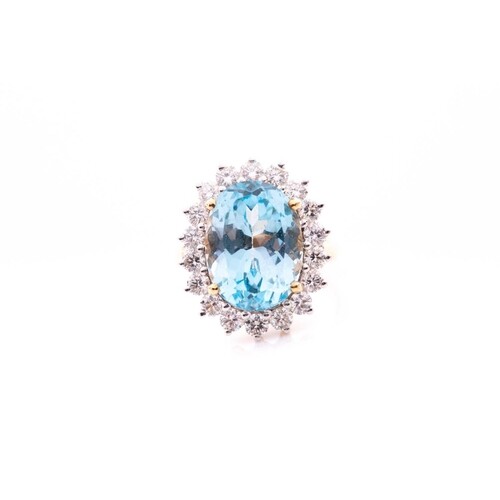 An 18ct yellow gold, diamond, and blue topaz cocktail ring, ...