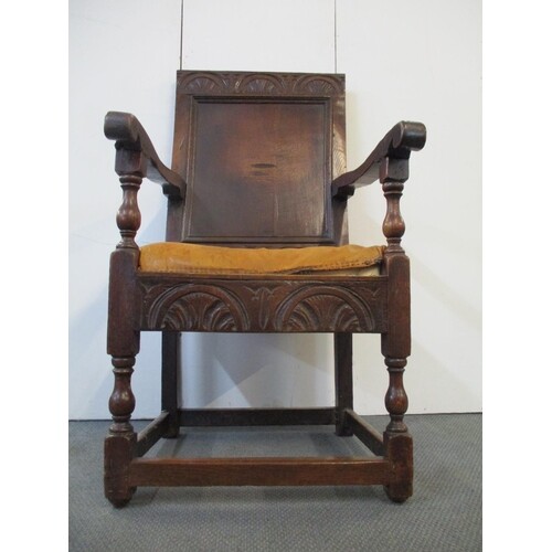 An 18th century oak Wainscote chair with a turned, carved cr...