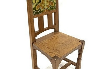 An Arts and Crafts oak and tile chair, possibly Leonard Wybu...