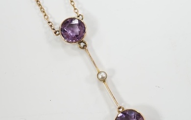 An Edwardian 9ct, two stone amethyst and single stone seed p...