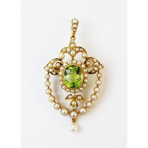 An Edwardian style peridot and seed pearl pendant/brooch, th...