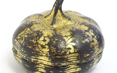 An Oriental lacquered pot and cover modelled as a gourd