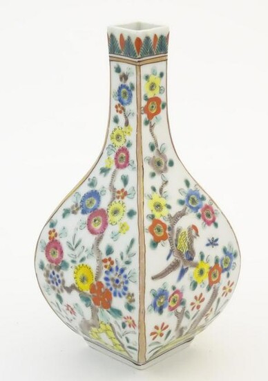 An Oriental vase of squared form decorated with flowers