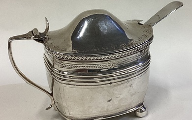 An early 19th Century silver mustard pot with BGL and spoon.