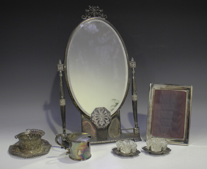 An early 20th century Secessionist style plated dressing table mirror of oval form with tapering pil