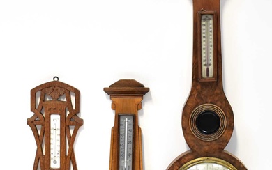 An early 20th century burr walnut five-dial barometer/thermometer with white...