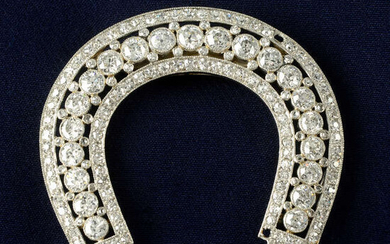 An early 20th century platinum diamond horseshoe-shape clip, by Cartier.
