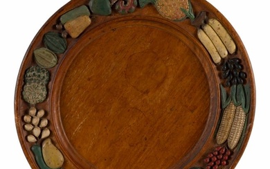 CARVED WOODEN CHARGER Early 20th Century Diameter 17.75".