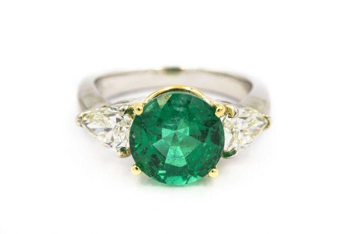 Contemporary Platinum Emerald and Diamond Ring