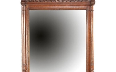 (-), Faceted mirror in oak richly decorated frame...
