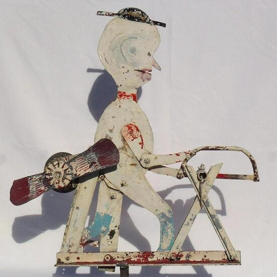 Great, folky metal whirligig made from found objects