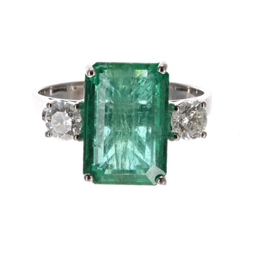 Large 18ct white gold three stone emerald and diamond ring, ...