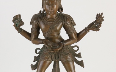 Large Eastern bronze Shiva figure with four arms, standing on a lotus flower. Size: H...