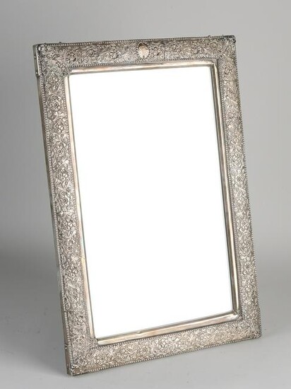 Large rectangular mirror with a richly decorated silver