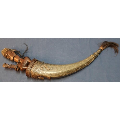 Late 19th C carved Batak Sumatran tribal horn flask, the ho...
