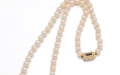 A long row of pearls with sapphire diamond clasp in...