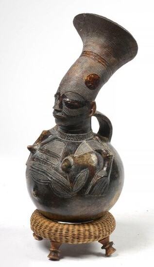 Mangbetu jug with anthropomorphic handle made of terracotta...