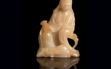 PALE YELLOW SOAPSTONE CARVING OF A SEATED GUANYIN QING DYNASTY, 19TH CENTURY