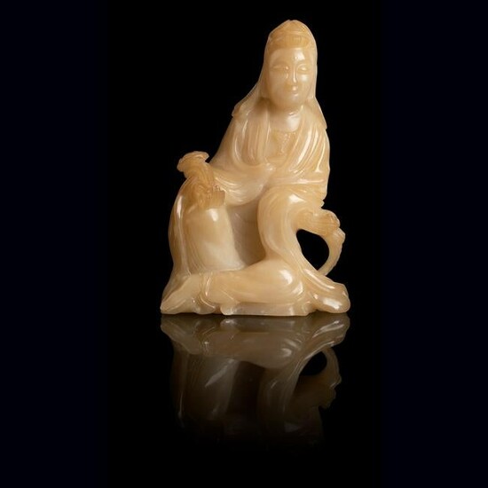 PALE YELLOW SOAPSTONE CARVING OF A SEATED GUANYIN QING