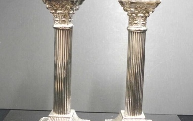 Pair Corinthian column form plated candlesticks