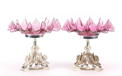 Pair of silver plated and ruby glass tazzas cast with mythic...