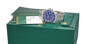 ROLEX. AN 18K WHITE GOLD AUTOMATIC WRISTWATCH WITH DATE, SWEEP CENTRE SECONDS, BRACELET, ORIGINAL GUARANTEE AND BOX, SIGNED ROLEX, OYSTER PERPETUAL DATE, SUBMARINER, 1000FT=300M, REF. 116619LB, CASE NO. 6H46F083, CIRCA 2018