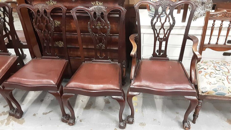 Set of six Georgian style Chippendale revival mahogany dining chairs with pierced splat backs and drop in seats on cabriole legs with claw and ball feet, comprising two carvers and four standards