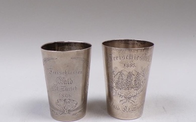 TWO CONTINENTAL SILVER BEAKERS WITH ENGRAVED FLORAL DECORATI...