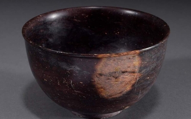 Thin-walled antique bowl with projecting lip on a small standing ring, porphyry-like stone, h. 10,5cm, Ø 15,6cm, traces of use