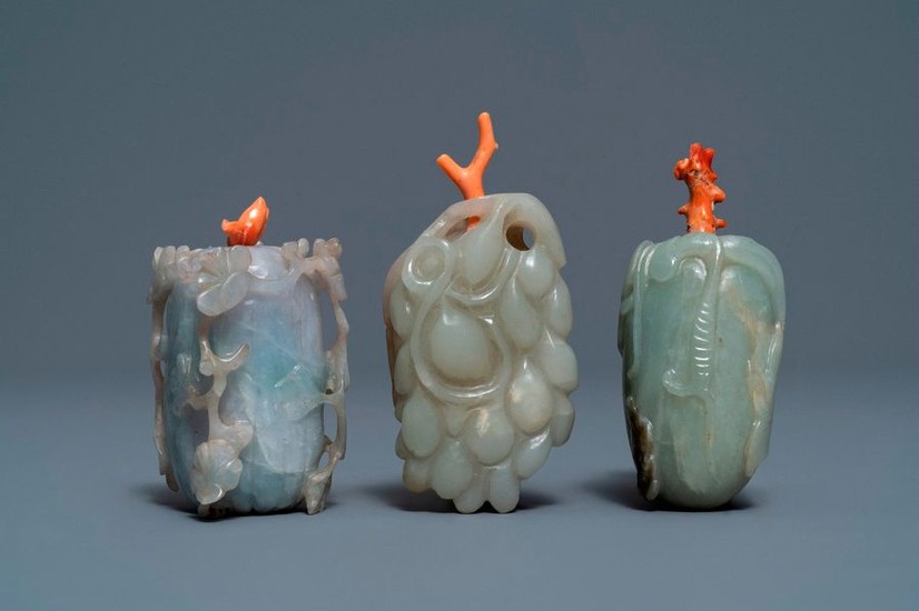 Three Chinese jade snuff bottles with coral stoppers,...