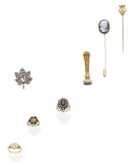 Three gem-set rings, a diamond leaf brooch, two stickpins, and a bloodstone seal