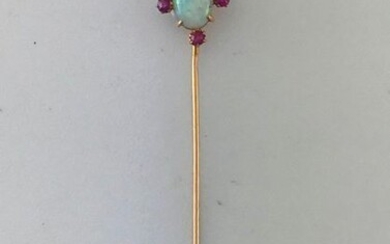 Tie pin in gold 750°/°°° with opal cabochon design enhanced with ruby, circa 1900, Gross weight:1,20g
