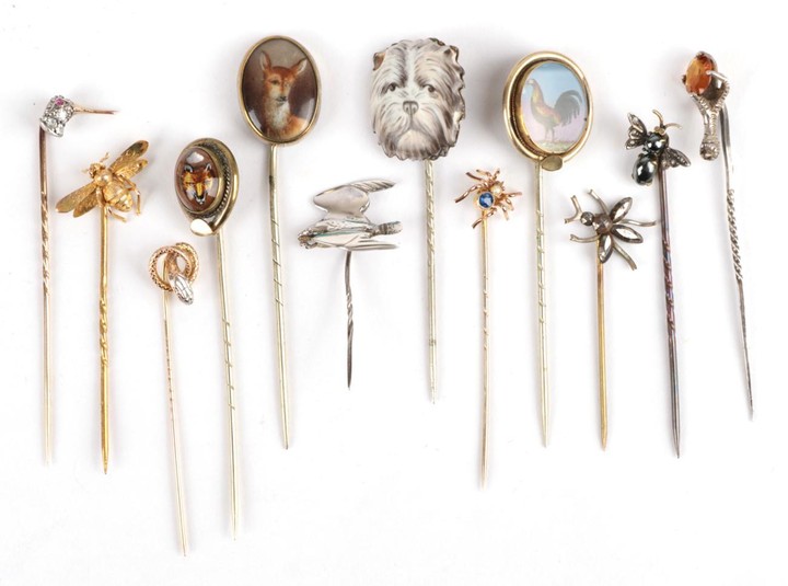 Twelve Stick Pins; including a diamond set bird example, cased,...