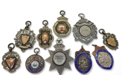 Various silver award medallions to include a Scots Guard exa...